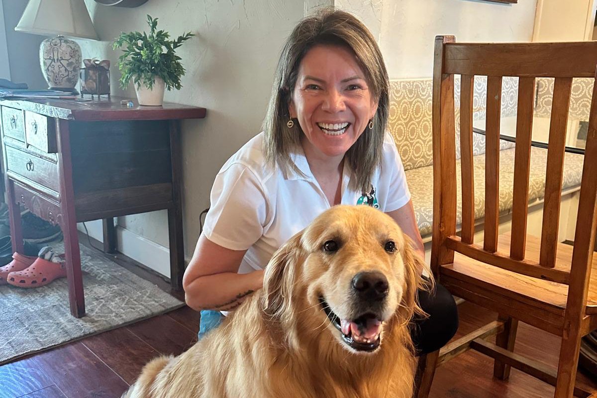 Mrs. AP Cleaning client with a dog in a bright home