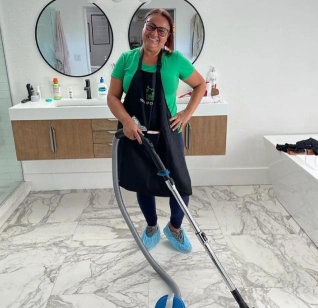 Smiley woman clean the floor